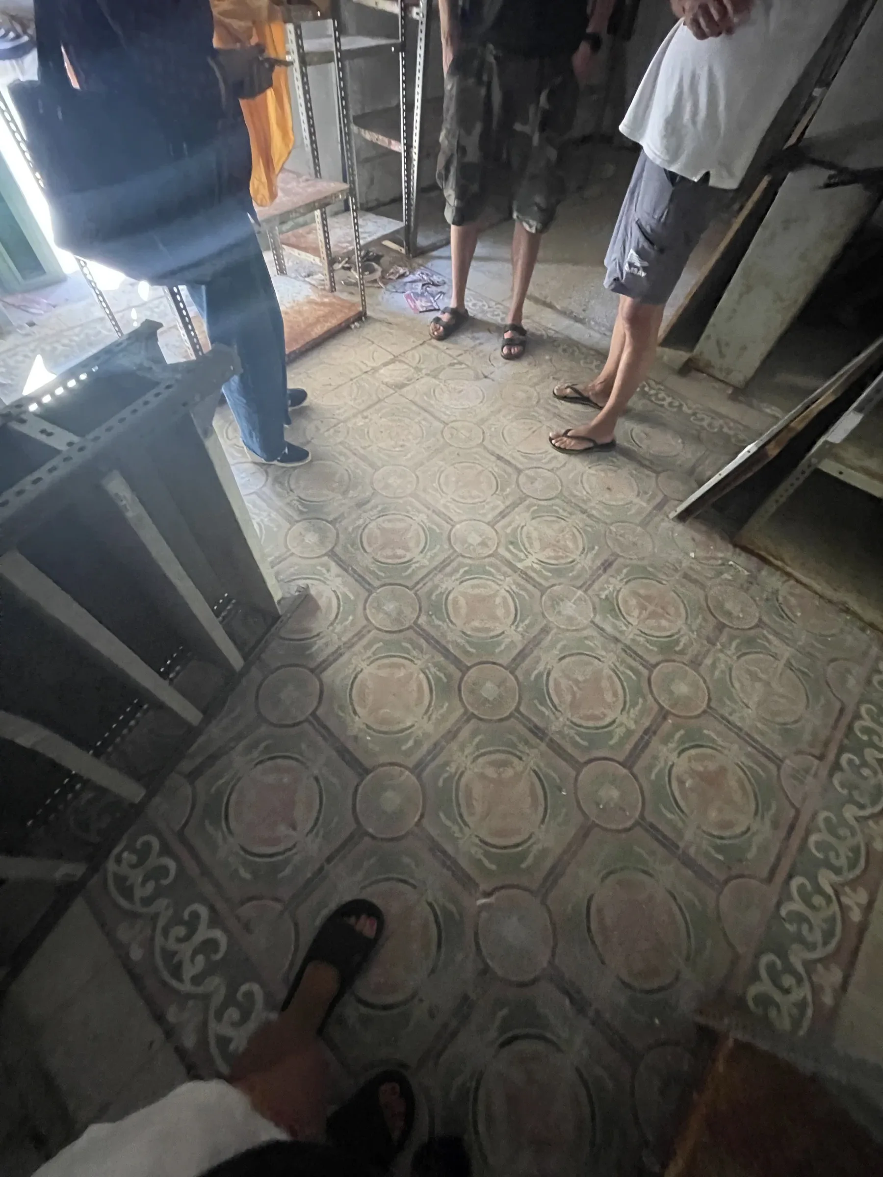 Historic patterned floor tiles in the existing building